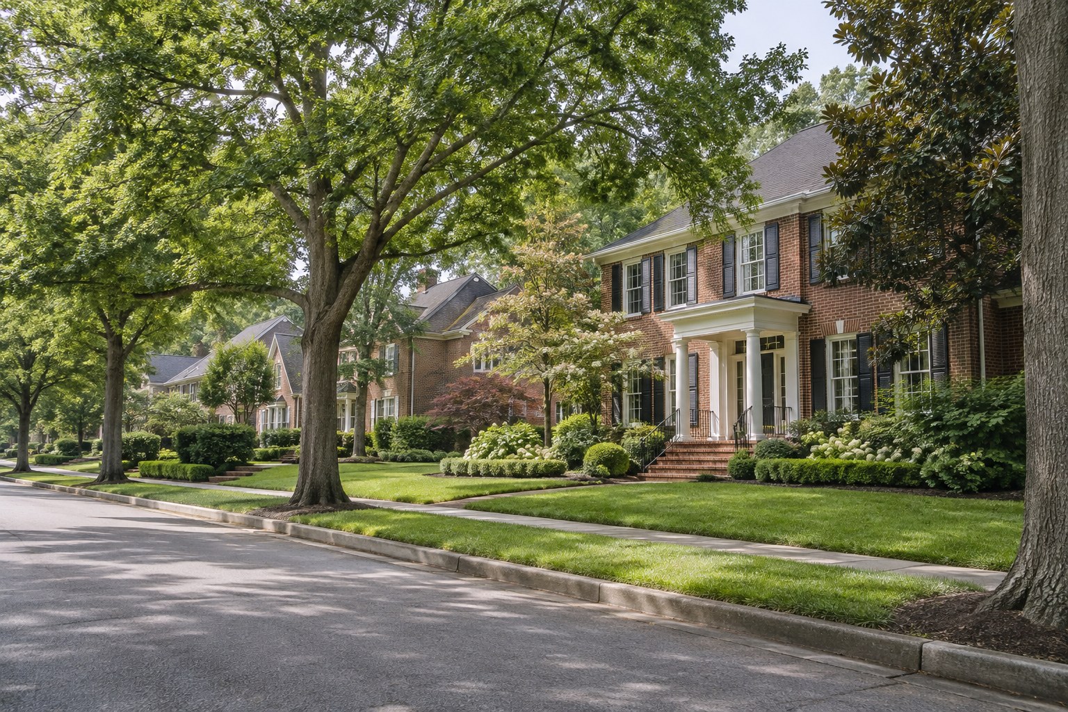A brick home with mature trees in the Memphis area, illustrative